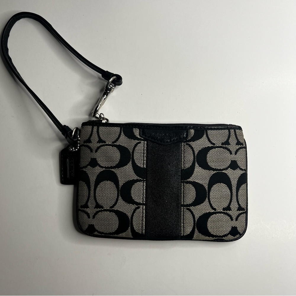 Coach Corner Zip Wristlet in Black Signature Canvas with a Stripe